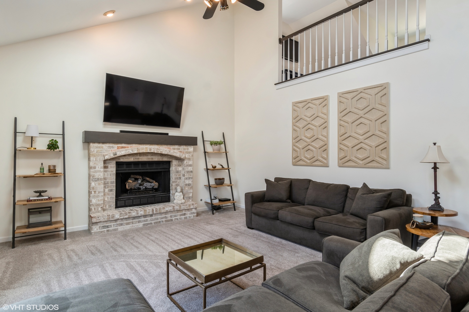 1449 Mesa Drive Bolingbrook, IL 60490 - Photo 13 of 34 a living room with furniture a flat screen tv and a fireplace