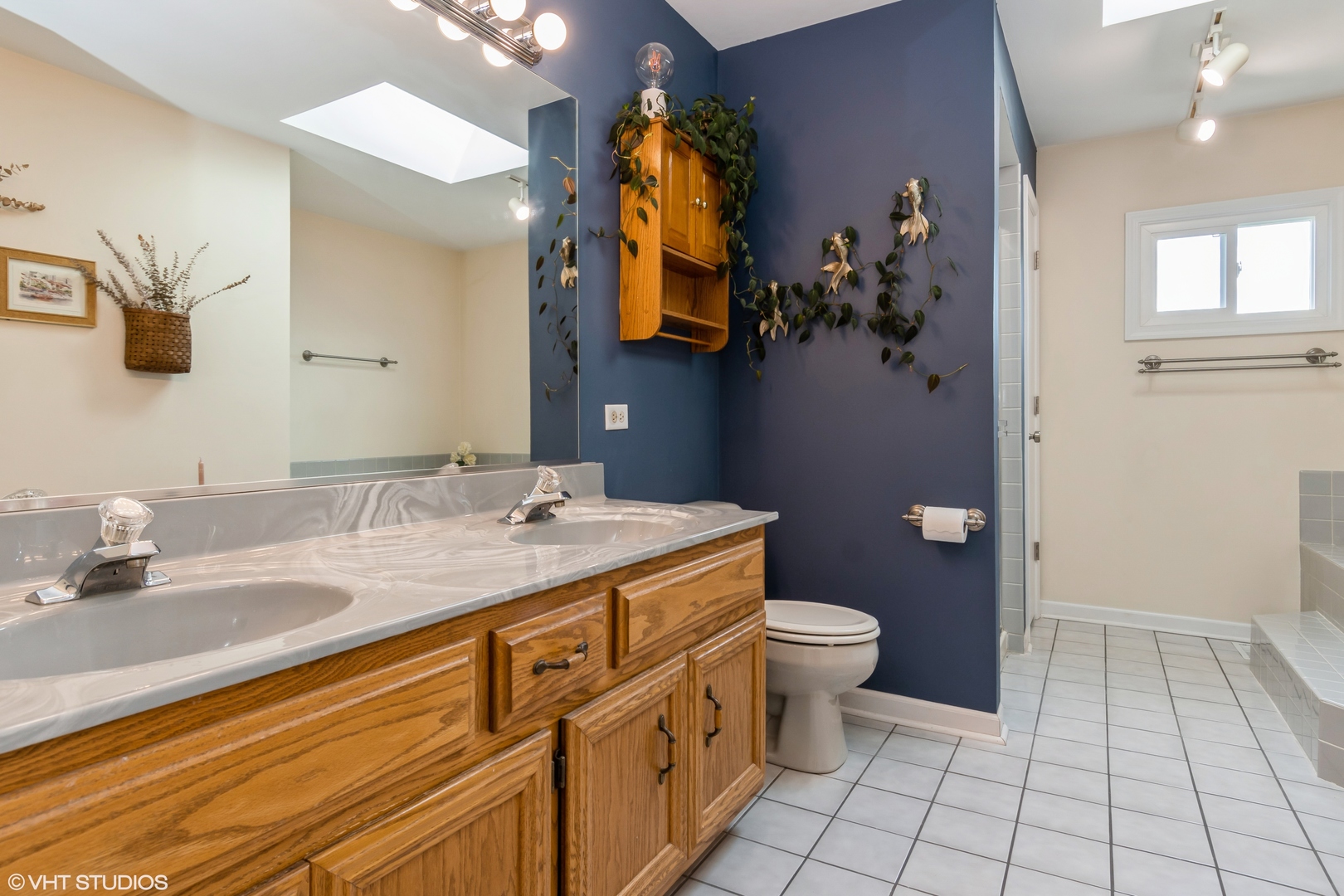 1449 Mesa Drive Bolingbrook, IL 60490 - Photo 19 of 34 a bathroom with a sink a toilet and mirror