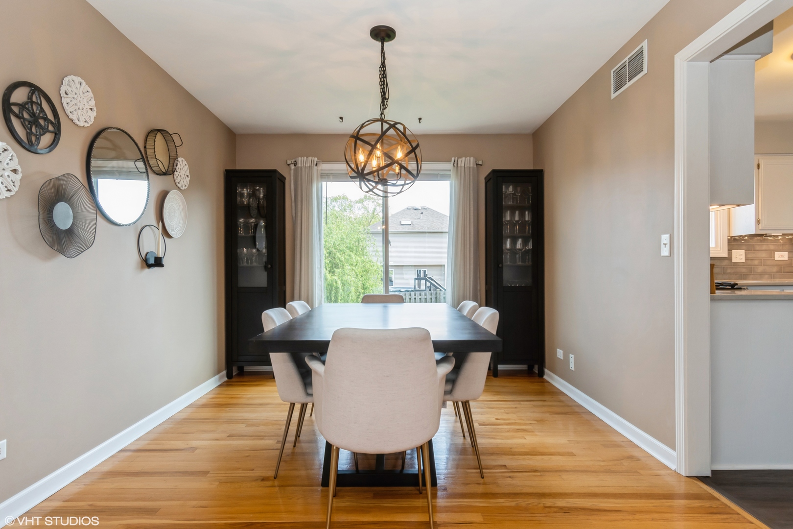 1449 Mesa Drive Bolingbrook, IL 60490 - Photo 6 of 34 a view of a dining room with furniture window and wooden floor