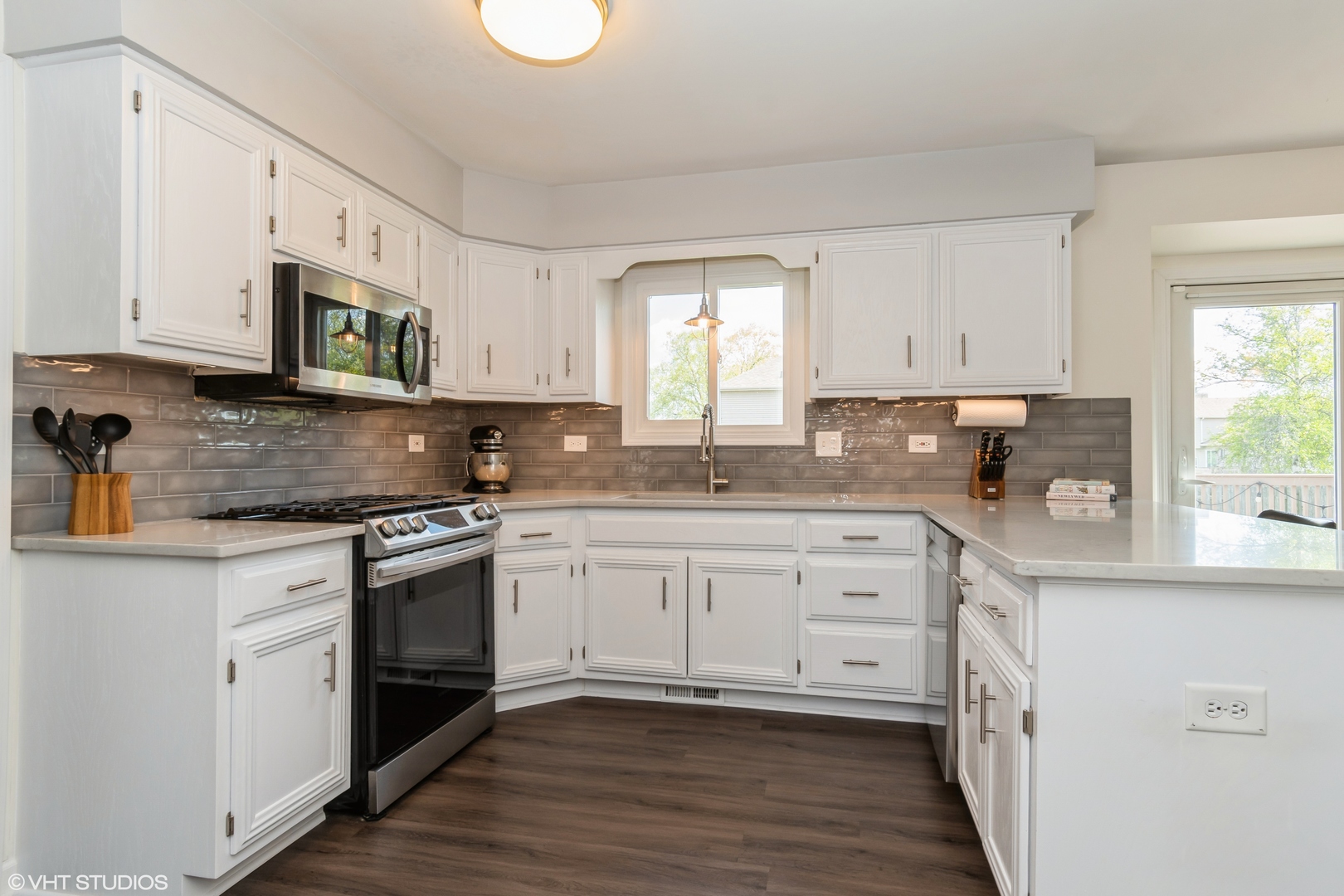 1449 Mesa Drive Bolingbrook, IL 60490 - Photo 7 of 34 a kitchen with stainless steel appliances granite countertop a stove a sink and a microwave