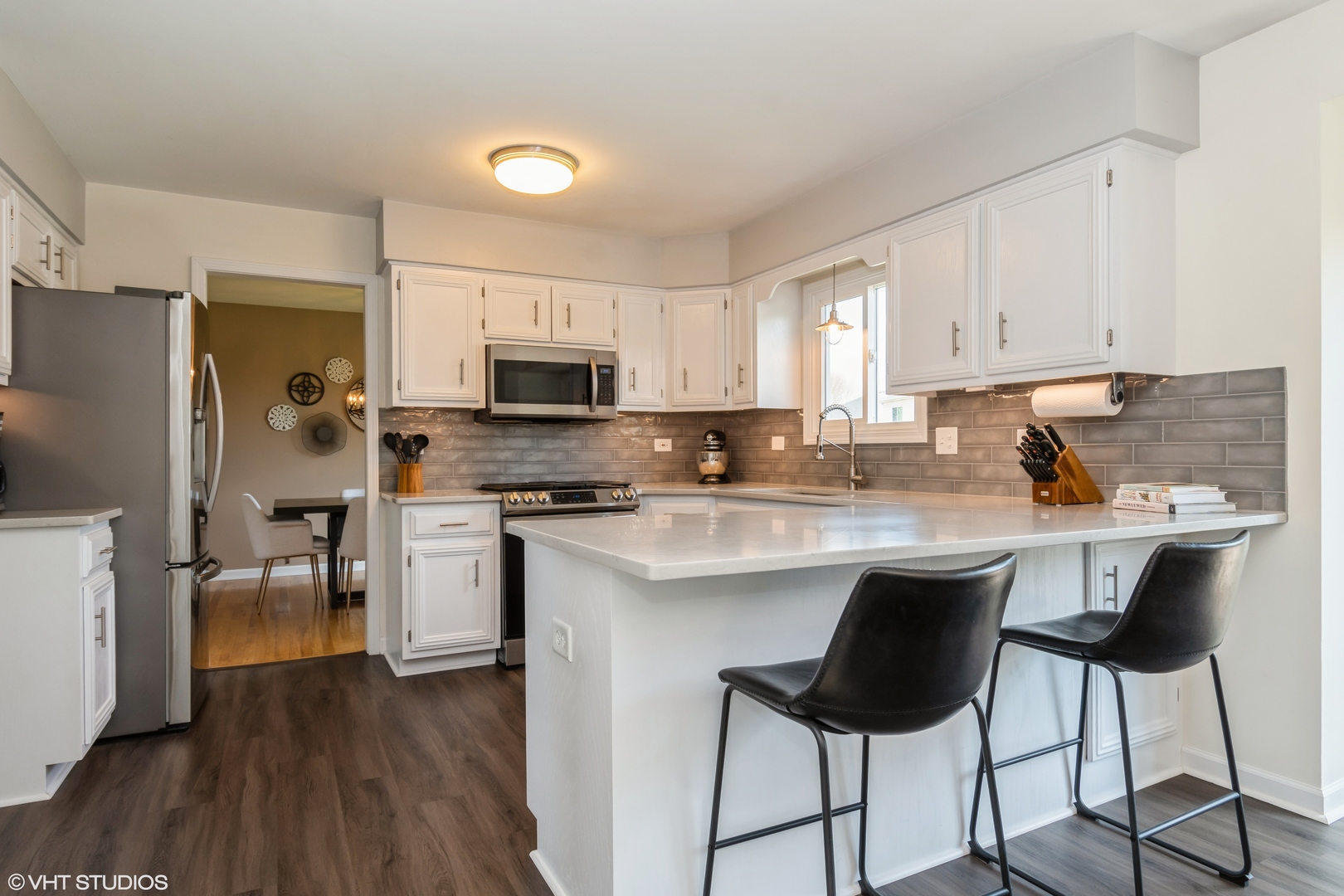 1449 Mesa Drive Bolingbrook, IL 60490 - Photo 8 of 34 a kitchen with stainless steel appliances a stove top oven a sink dishwasher and a refrigerator with wooden floor