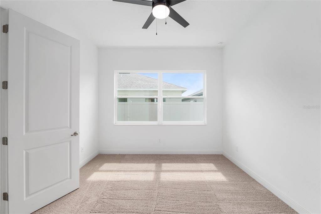 4722 Southeast 25th Loop Ocala, FL 34480 - Photo 20 of 38 an empty room with windows