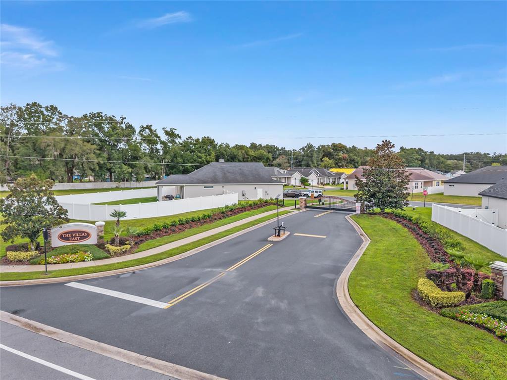 4722 Southeast 25th Loop Ocala, FL 34480 - Photo 2 of 38 an aerial view of a house with a garden and lake view