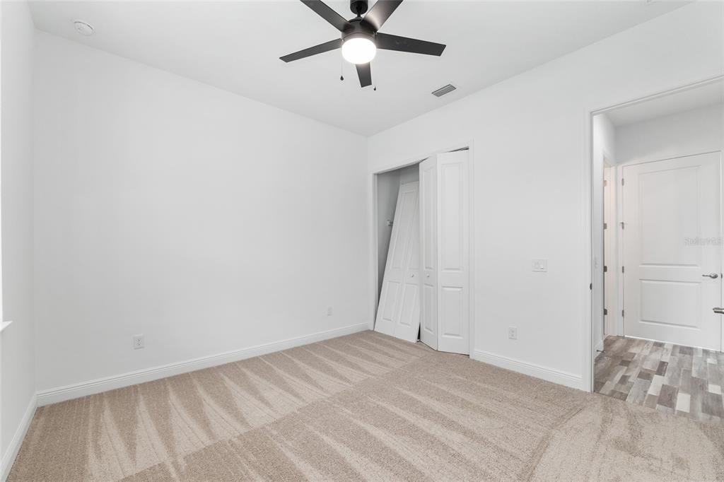 4722 Southeast 25th Loop Ocala, FL 34480 - Photo 34 of 38 wooden floor in an empty room