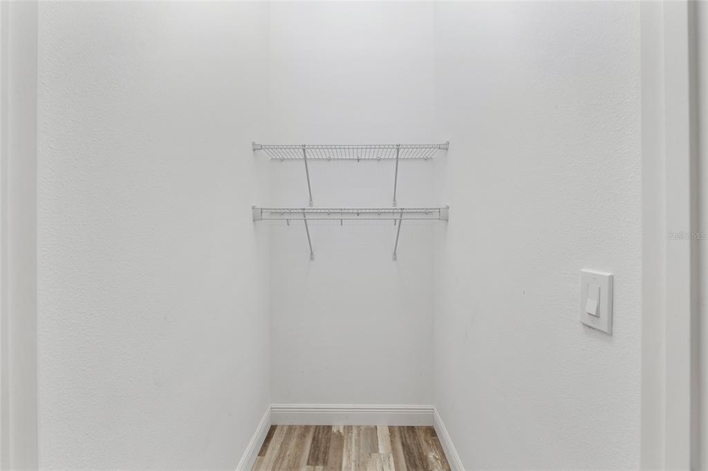 4722 Southeast 25th Loop Ocala, FL 34480 - Photo 36 of 38 a view of a room with racks on the wall