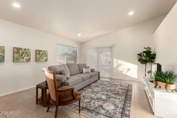 a living room with furniture and a large window