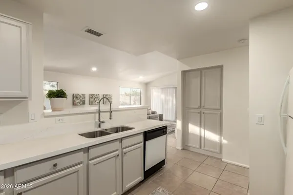 a kitchen with stainless steel appliances a refrigerator a stove a microwave and cabinets