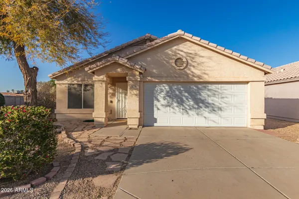 a view of a street with a building in the background
