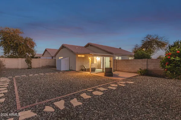 a view of a dining room with furniture and a large window