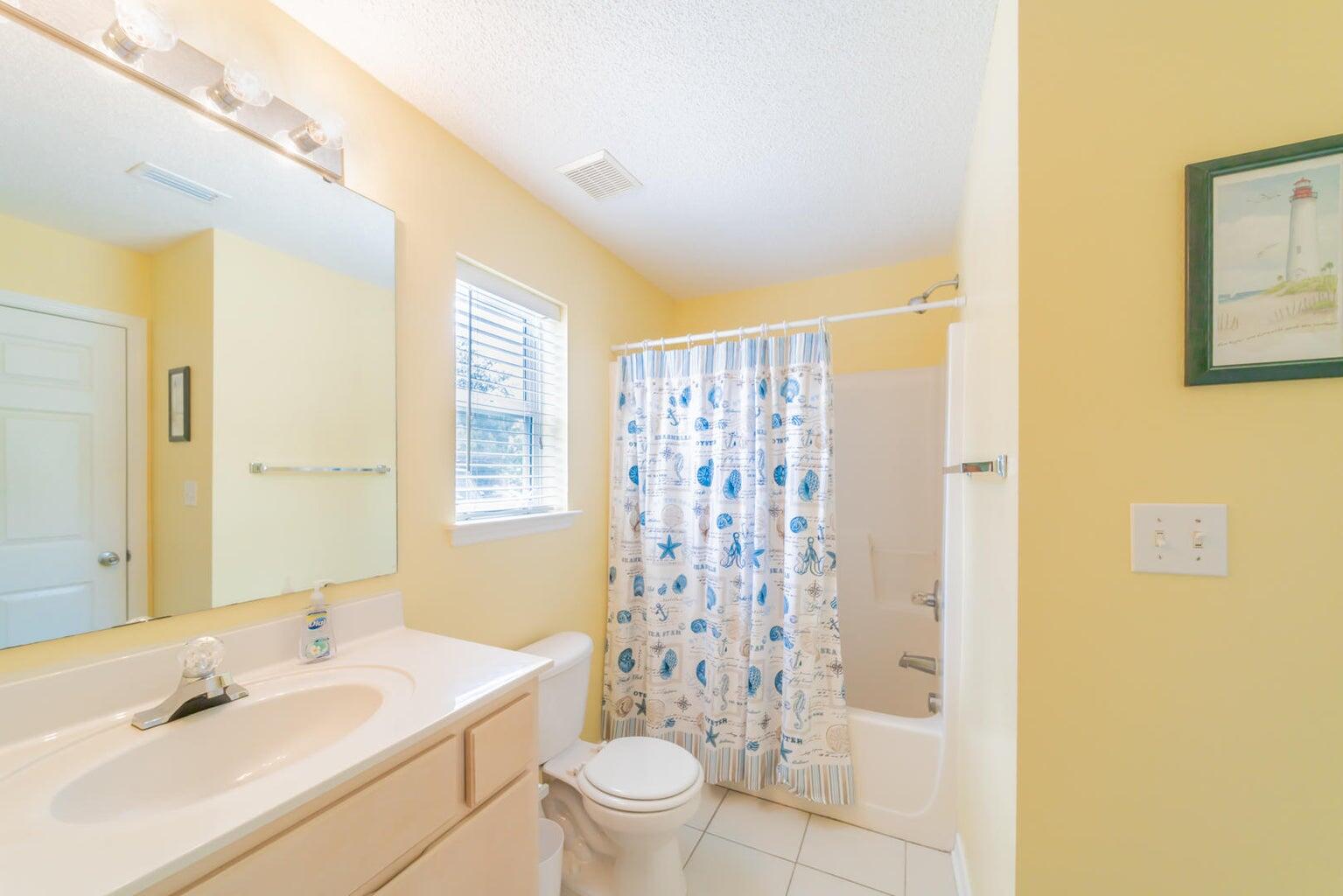 82 Sugar Sand Lane, Unit C3 Santa Rosa Beach, FL 32459 - Photo 11 of 16 a bathroom with a sink a toilet and shower curtain