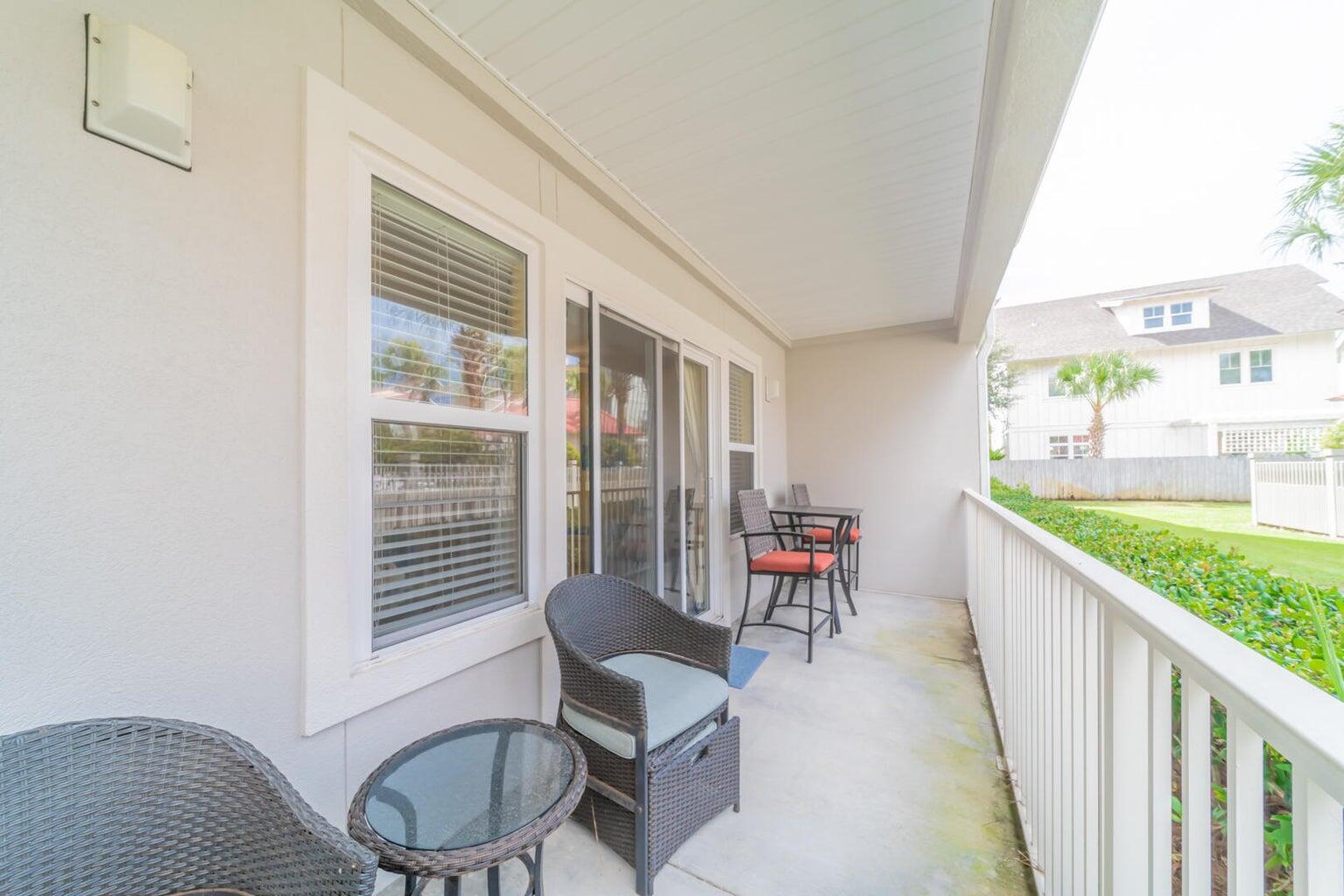82 Sugar Sand Lane, Unit C3 Santa Rosa Beach, FL 32459 - Photo 12 of 16 a balcony with chairs and table