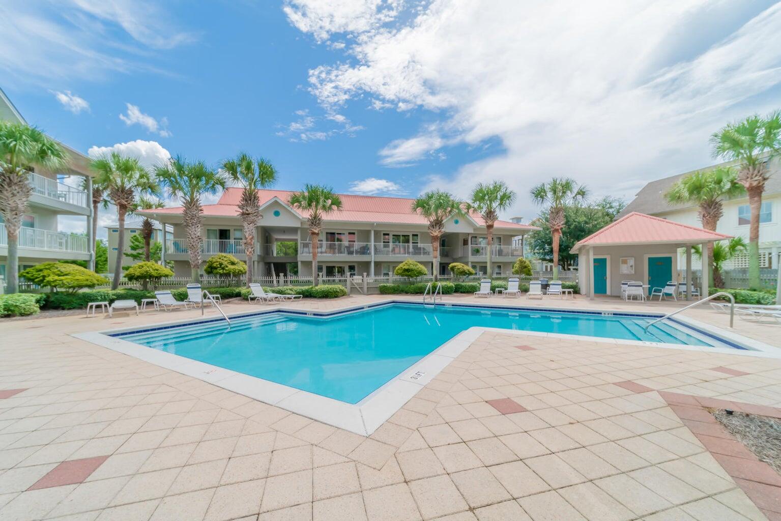 82 Sugar Sand Lane, Unit C3 Santa Rosa Beach, FL 32459 - Photo 16 of 16 a view of pool with lawn chairs under an umbrella