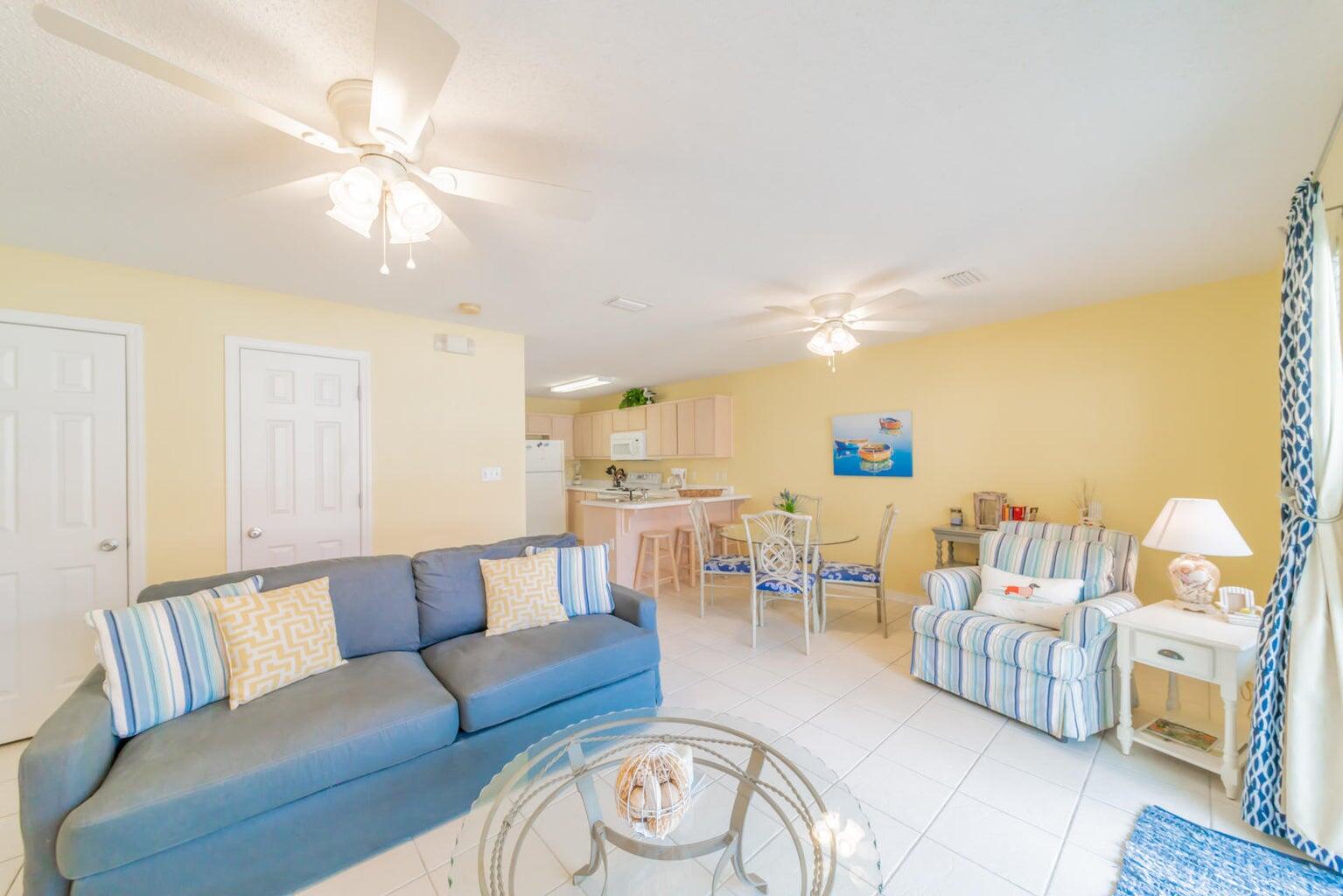 82 Sugar Sand Lane, Unit C3 Santa Rosa Beach, FL 32459 - Photo 3 of 16 a living room with furniture and a chandelier