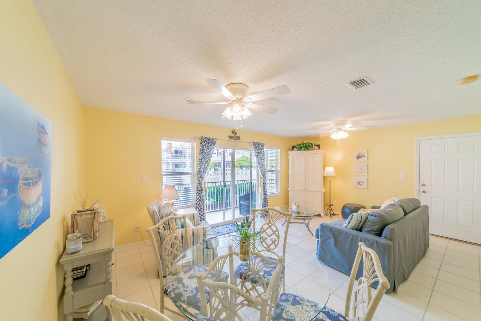 82 Sugar Sand Lane, Unit C3 Santa Rosa Beach, FL 32459 - Photo 5 of 16 a living room with furniture and large windows
