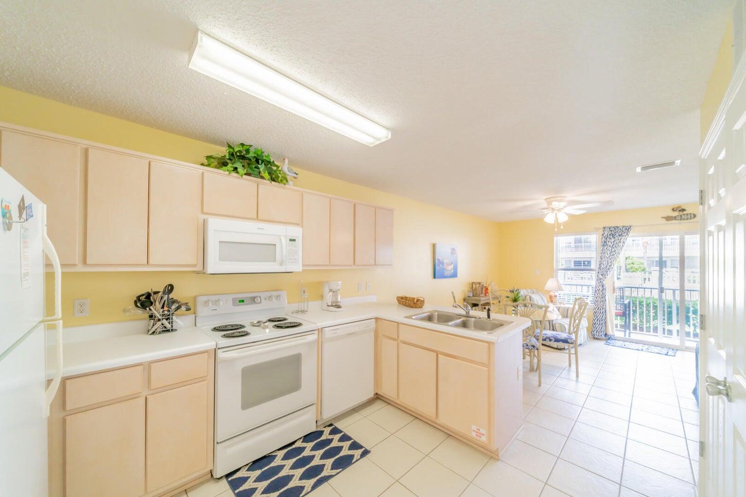 82 Sugar Sand Lane, Unit C3 Santa Rosa Beach, FL 32459 - Photo 8 of 16 a kitchen with a sink stove and cabinets