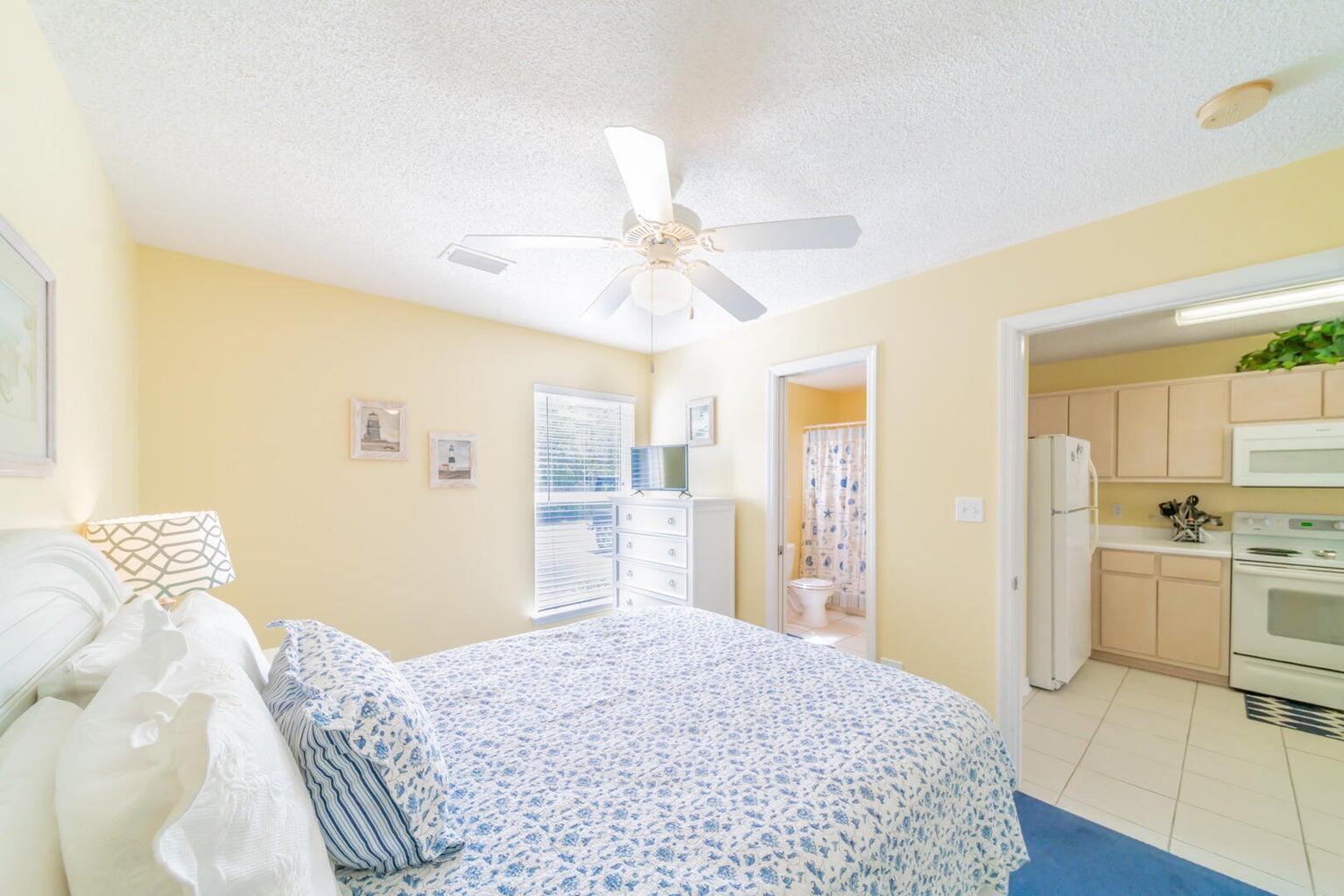 82 Sugar Sand Lane, Unit C3 Santa Rosa Beach, FL 32459 - Photo 10 of 16 a bedroom with a bed and a chandelier