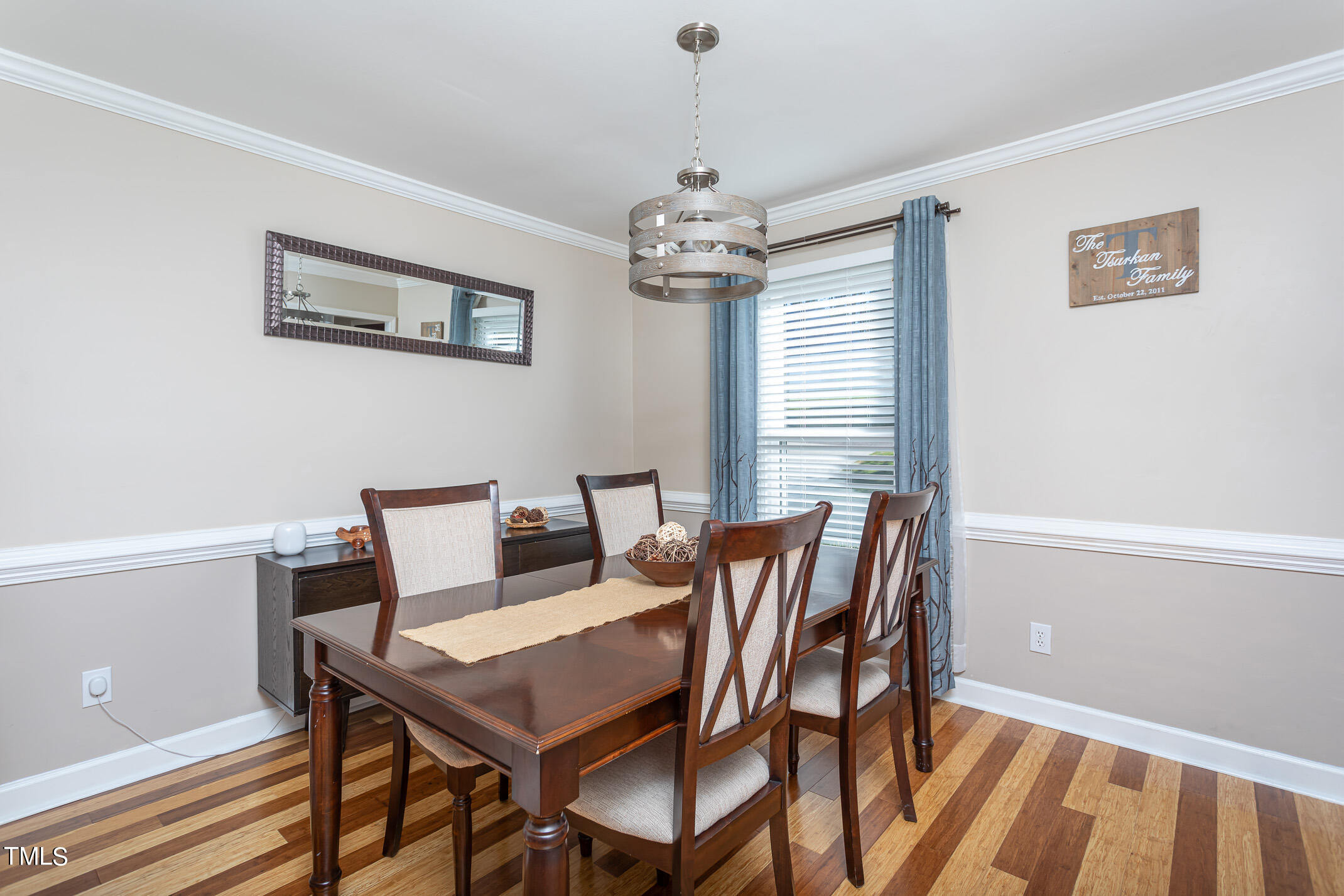 3213 Terrel Mill Road Raleigh, NC 27616 - Photo 4 of 20 Chair rail, crown molding, updated lighting!