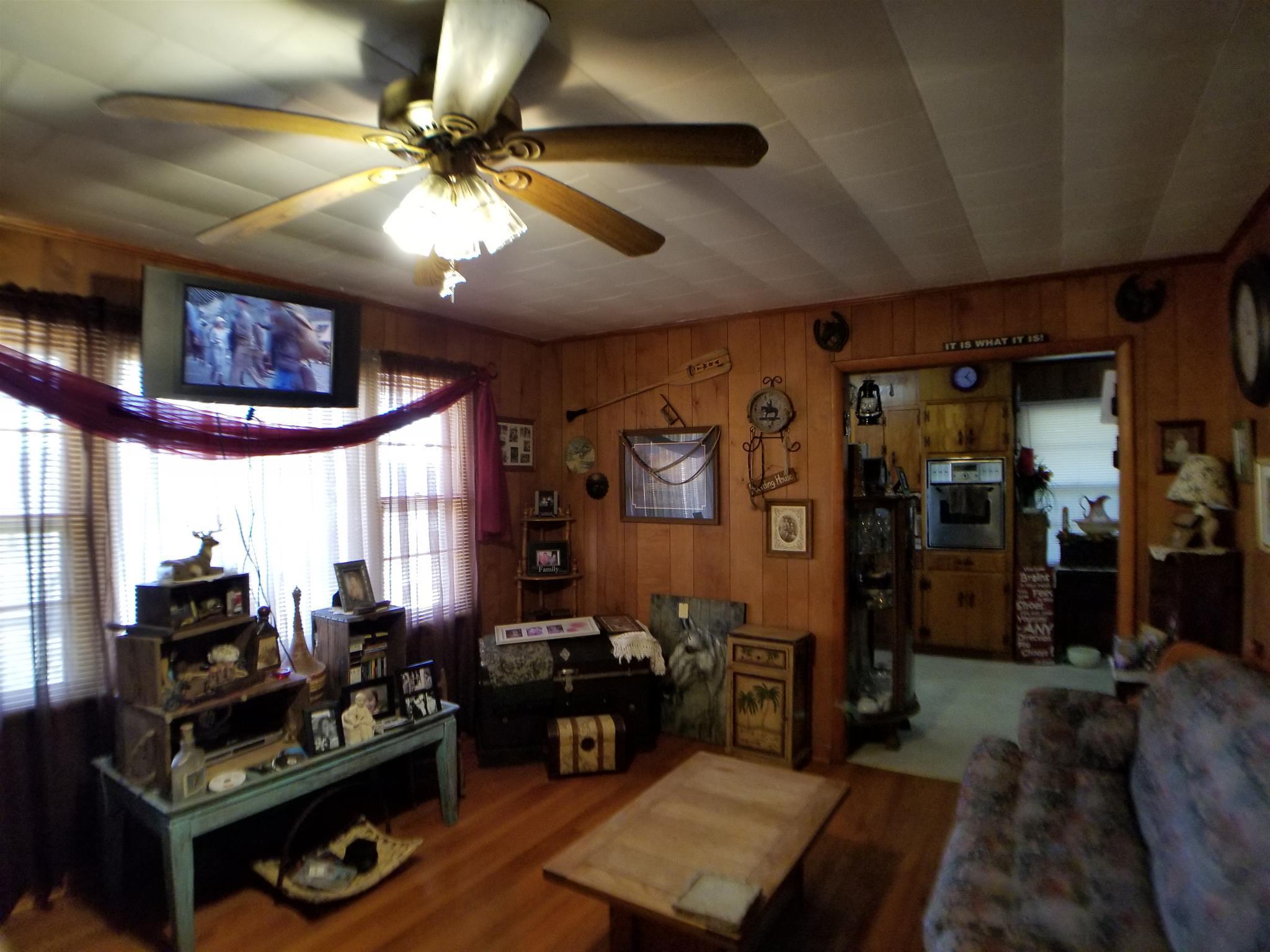 7535 Natchez Trace Road Camden, TN 38320 - Photo 11 of 22 Living Room Picture Window Offers Full View of Front Yard and Road