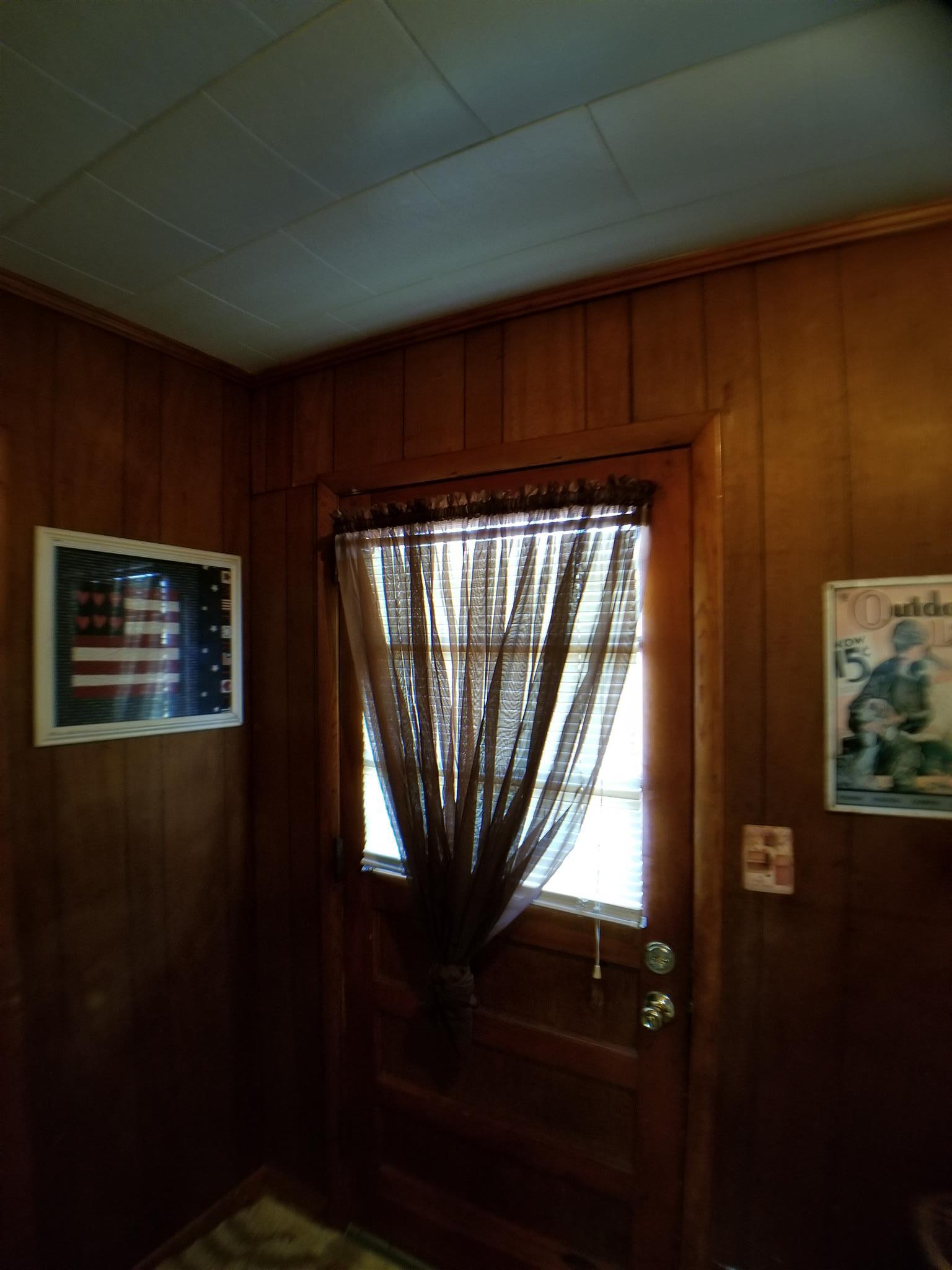 7535 Natchez Trace Road Camden, TN 38320 - Photo 22 of 22 Laundry Room Door Leading to Small Back Porch and Back Yard