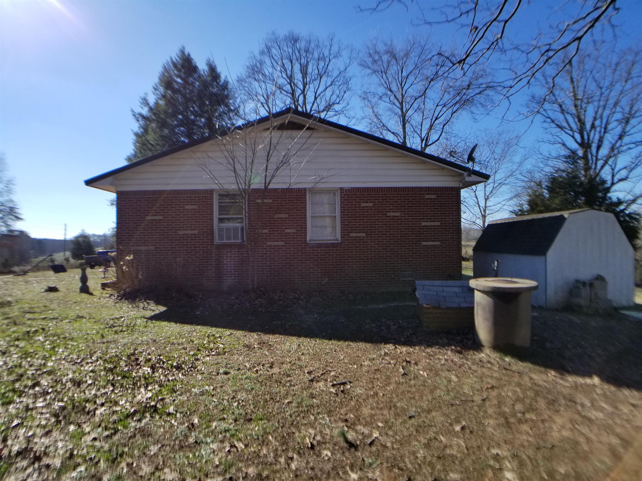 7535 Natchez Trace Road Camden, TN 38320 - Photo 3 of 22 Right Exterior with Storage Building