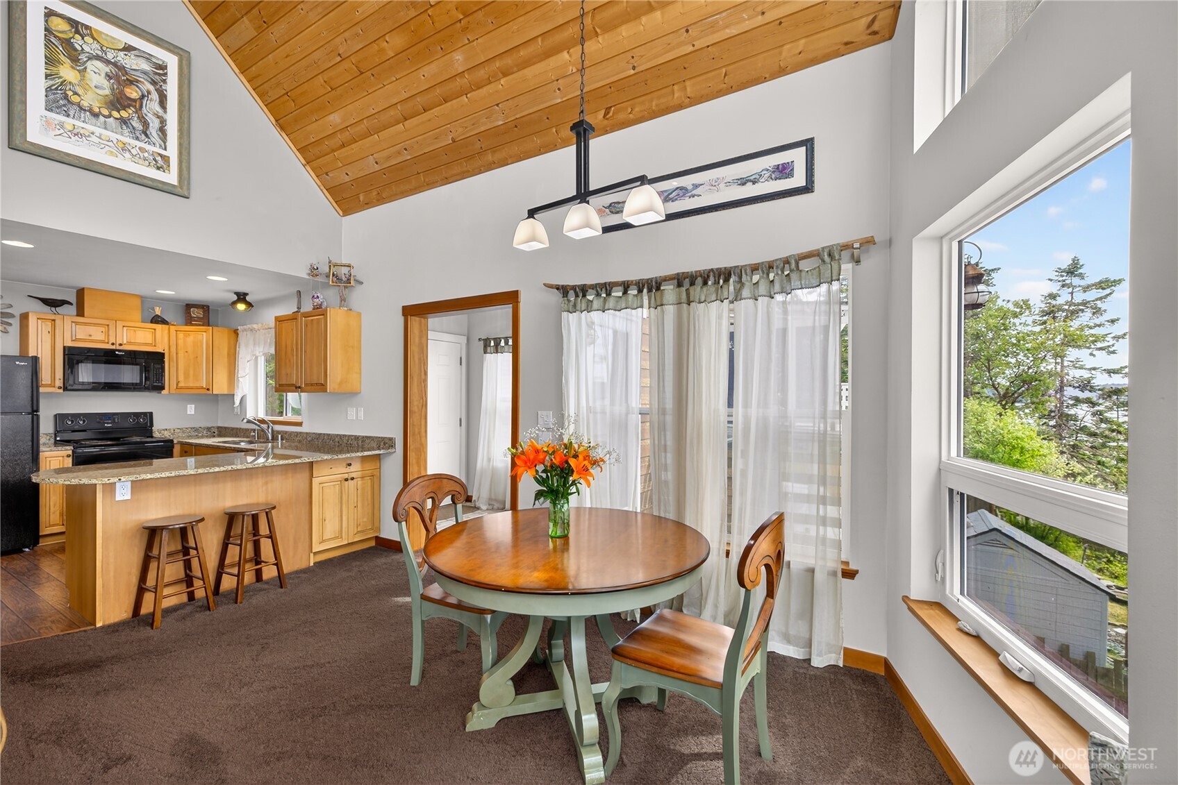 17946 Cobahud Road La Conner, WA 98257 - Photo 24 of 40 a kitchen with a table and chairs in it