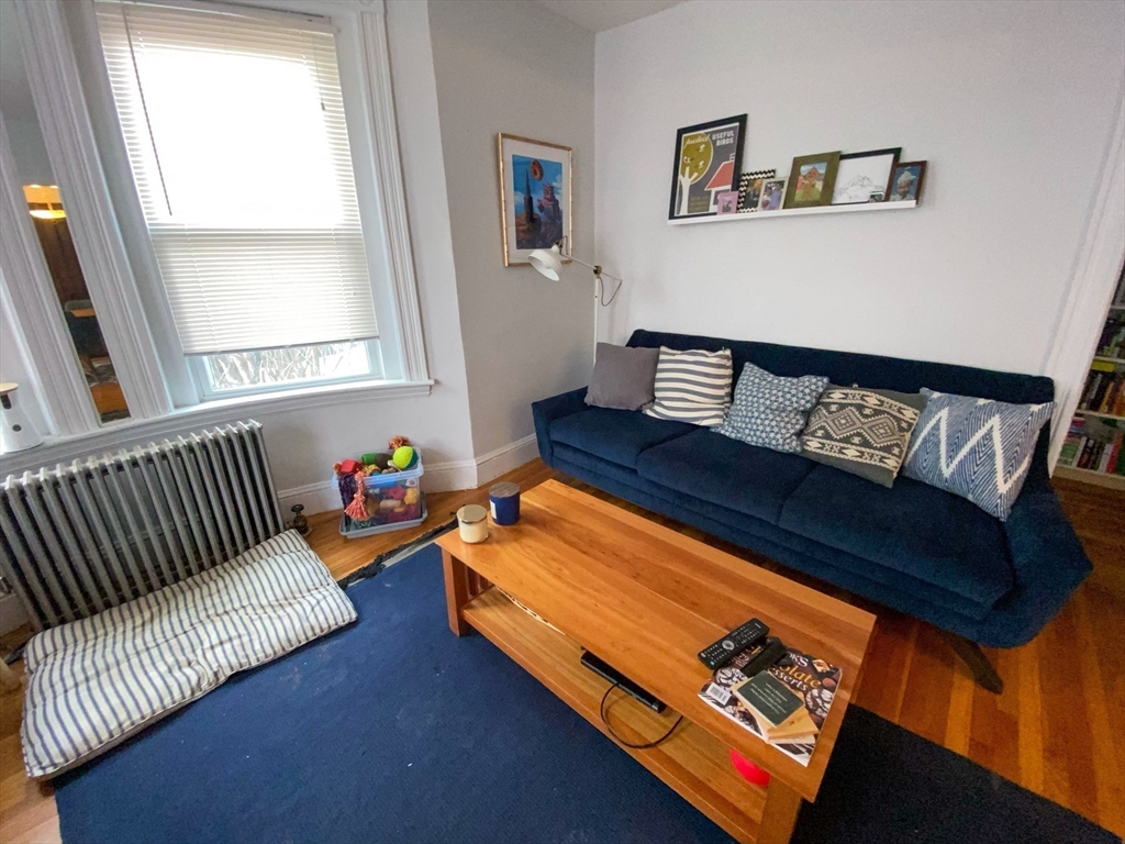 125 Brattle Street, Unit 1 Arlington, MA 02474 - Photo 6 of 10 a living room with furniture and a window