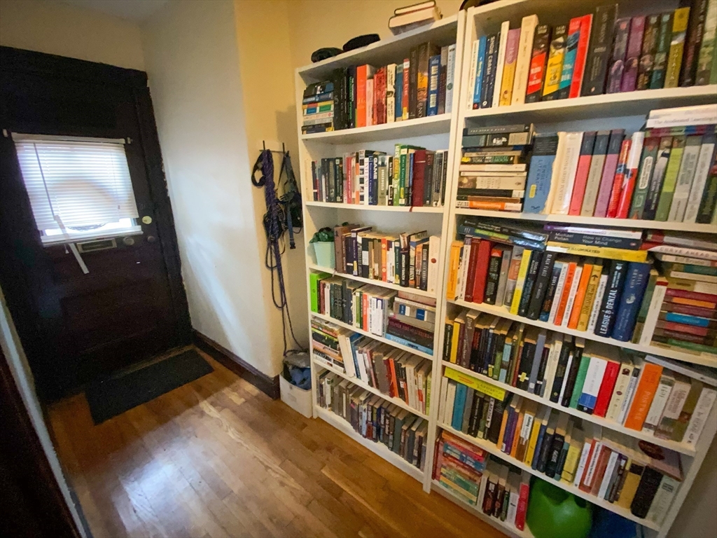 125 Brattle Street, Unit 1 Arlington, MA 02474 - Photo 10 of 10 a view of an empty room with furniture and staircase