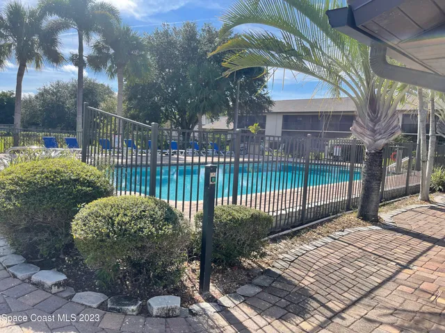 a view of a wrought iron fences in front of house