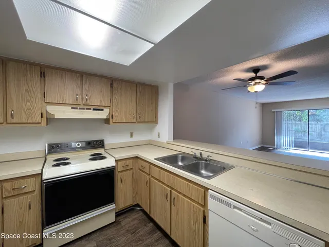 a kitchen with a stove and a sink