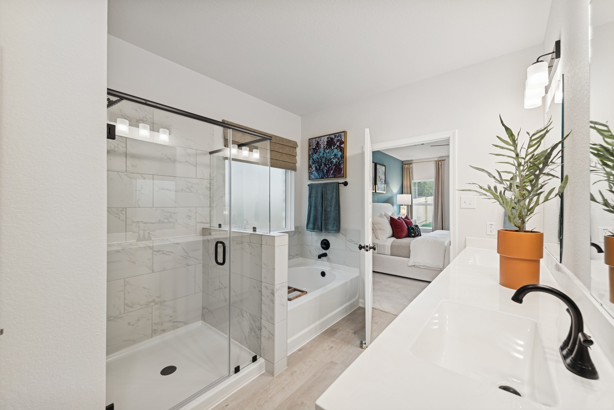 9726 Enclave Ridge Road Willis, TX 77318 - Photo 13 of 25 a bathroom with a bathtub and a shower