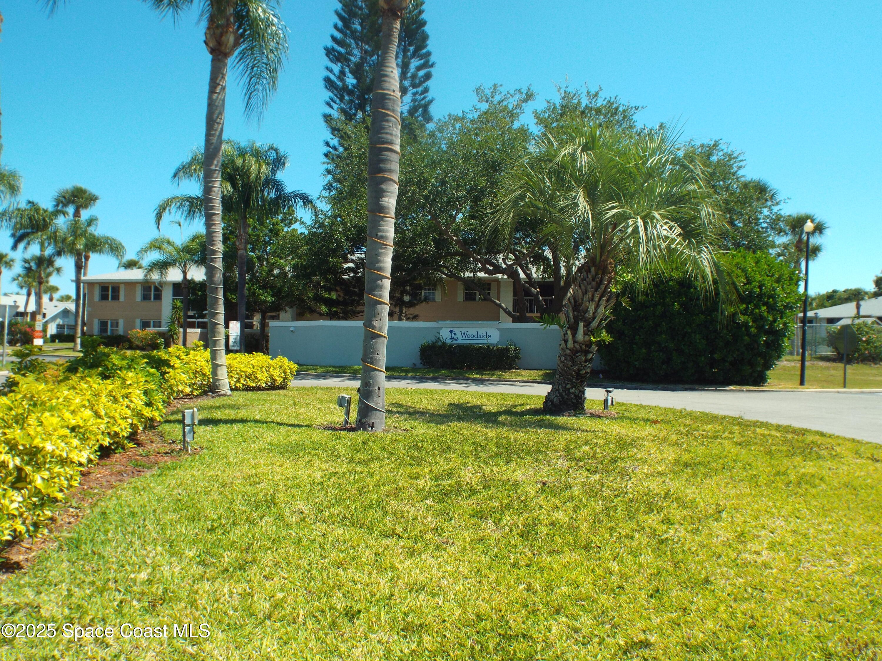 927 Sonesta Avenue Northeast, Unit 202 Palm Bay, FL 32905 - Photo 12 of 12 a view of a swimming pool with a patio