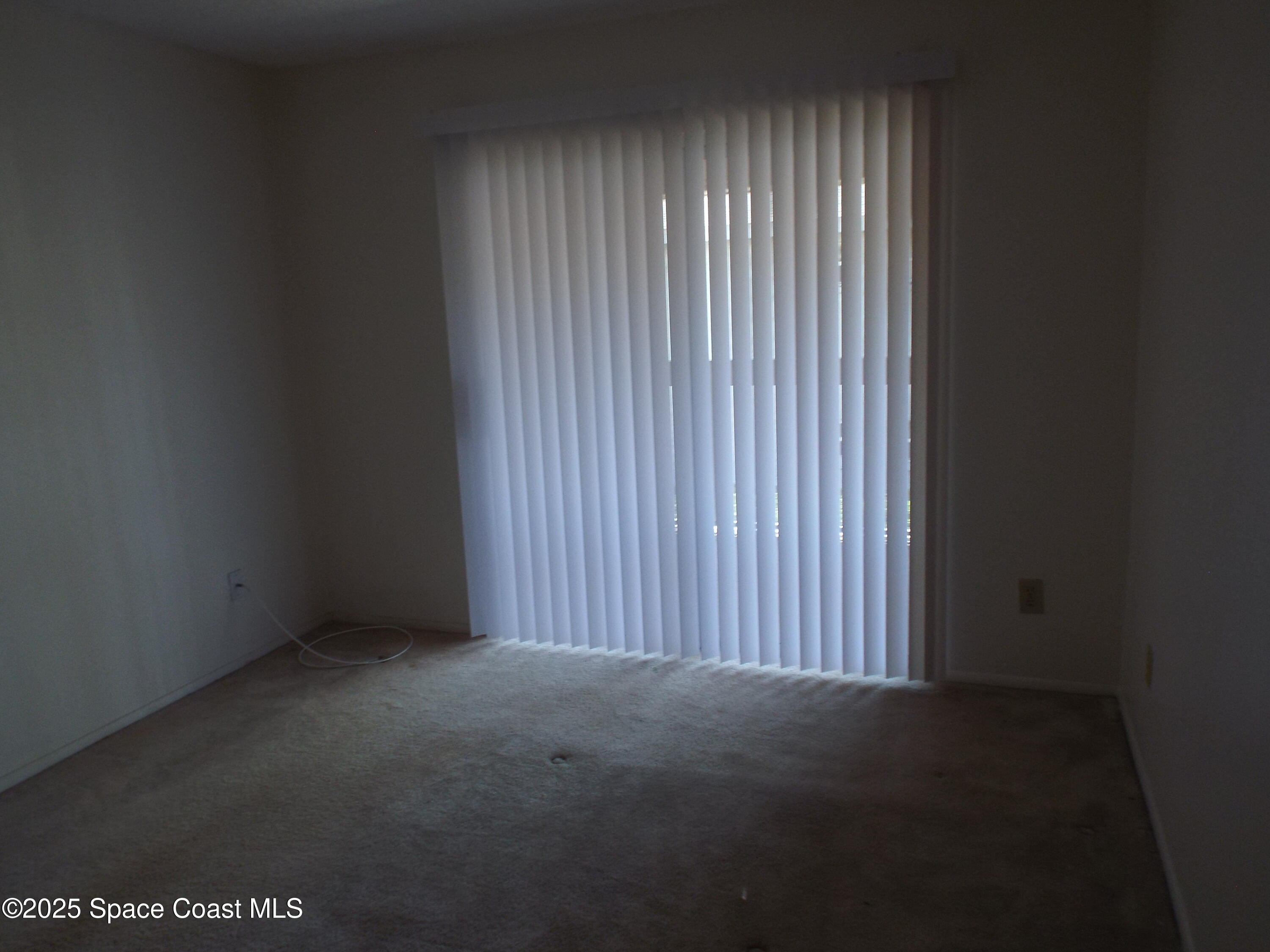 927 Sonesta Avenue Northeast, Unit 202 Palm Bay, FL 32905 - Photo 4 of 12 a view of a room