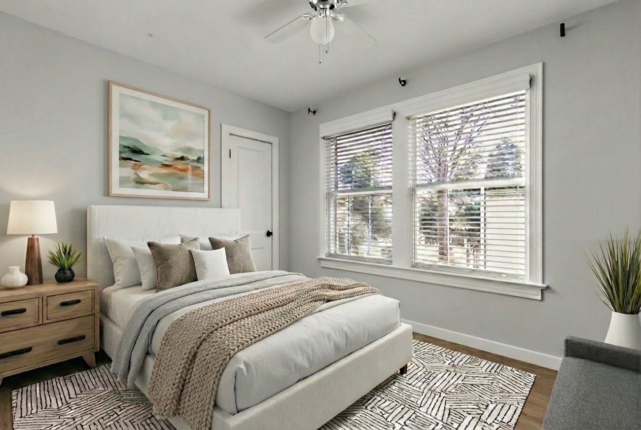 4517 Bull Creek Road Austin, TX 78731 - Photo 25 of 35 a bedroom with a large bed and a window