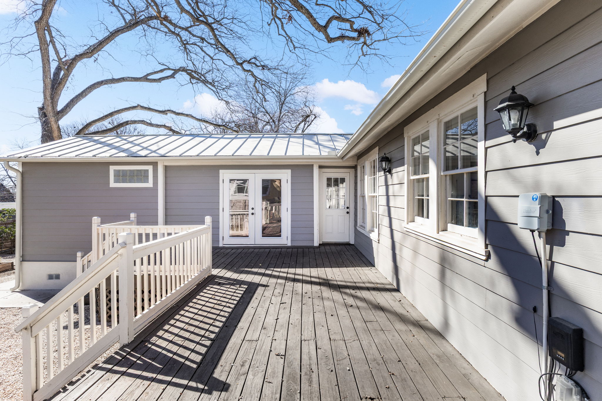4517 Bull Creek Road Austin, TX 78731 - Photo 28 of 35 a view of a house with wooden deck