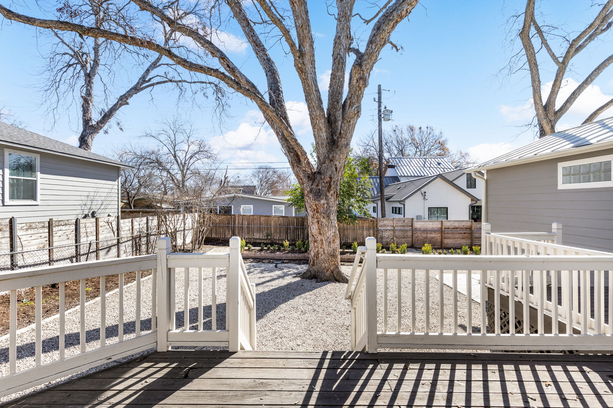 4517 Bull Creek Road Austin, TX 78731 - Photo 31 of 35 a view of a brick house with wooden fence