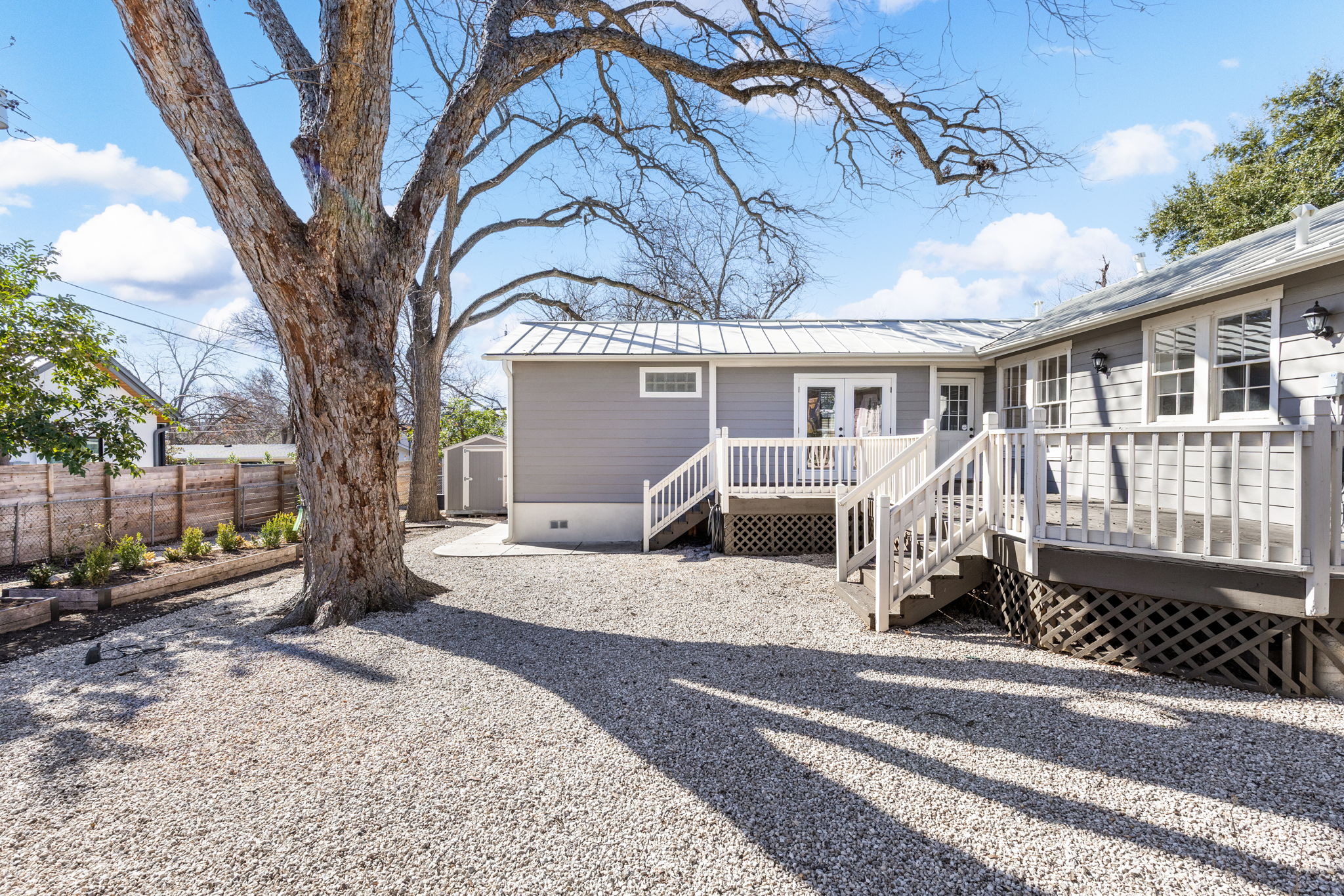 4517 Bull Creek Road Austin, TX 78731 - Photo 33 of 35 a view of a house with a yard and balcony