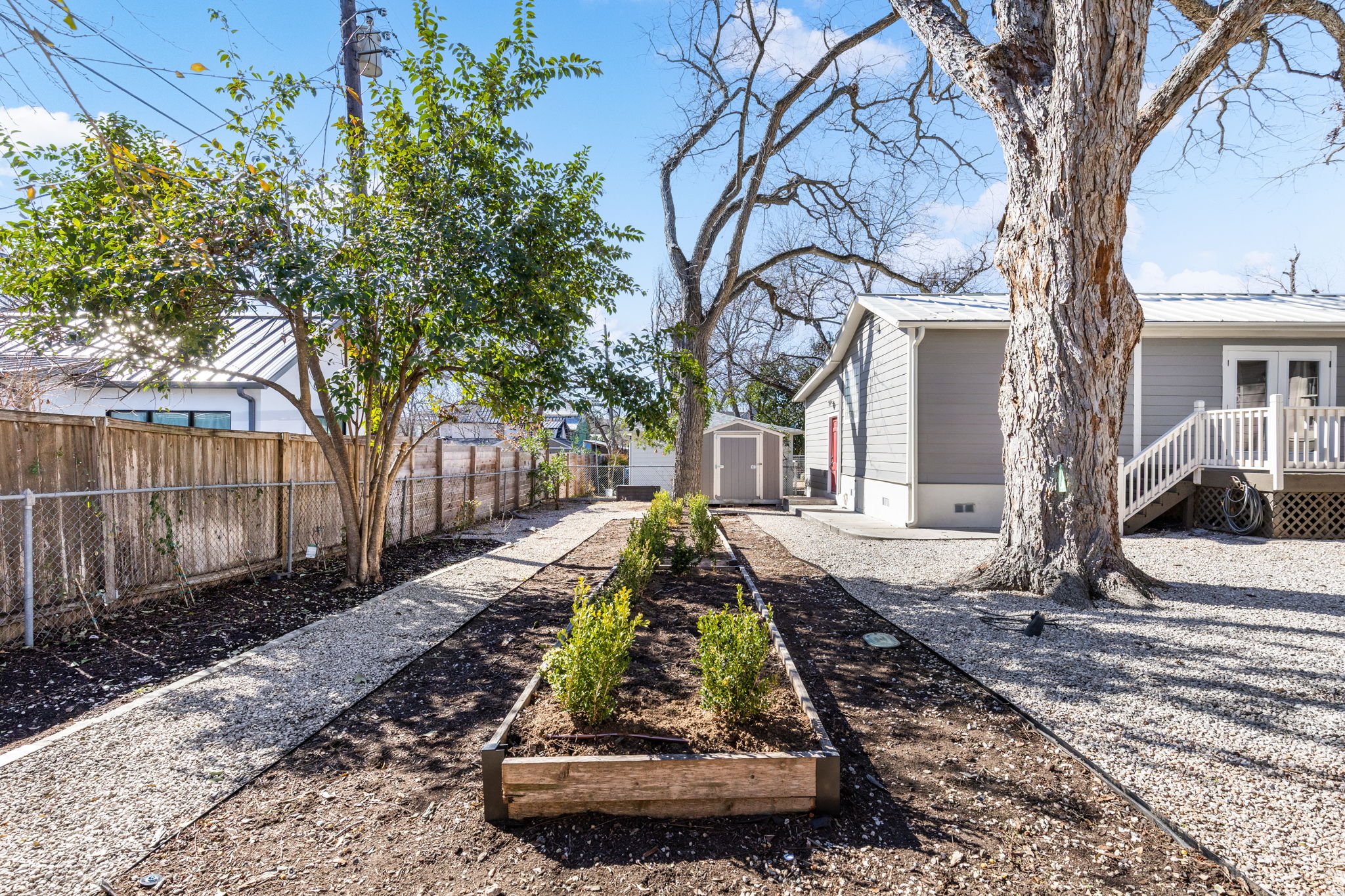 4517 Bull Creek Road Austin, TX 78731 - Photo 34 of 35 a view of a yard with plants and a trees