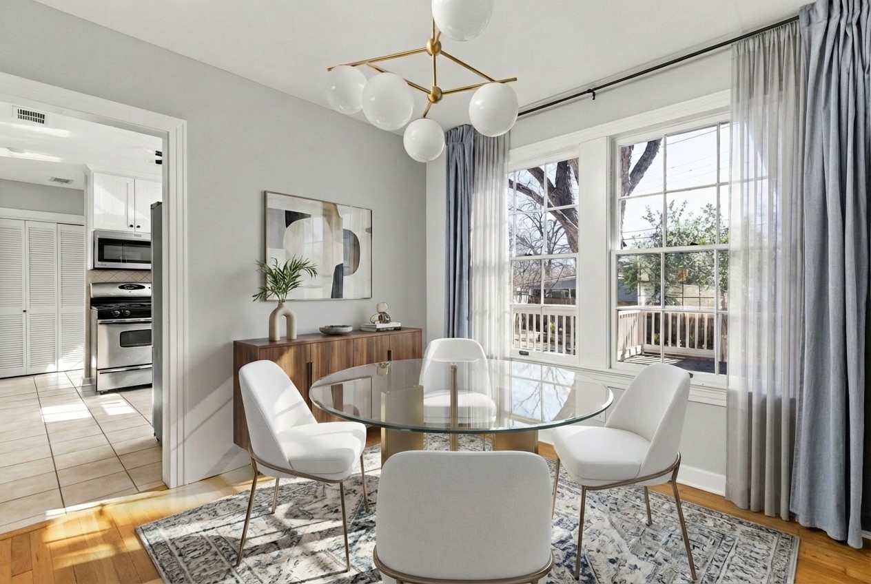 4517 Bull Creek Road Austin, TX 78731 - Photo 7 of 35 a dining room with furniture a chandelier and wooden floor
