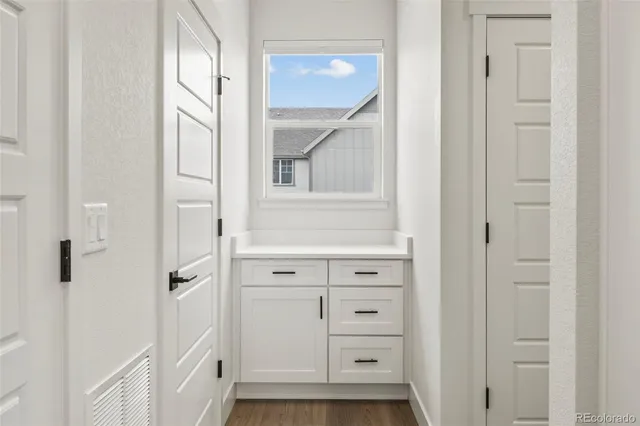 a view of a house with pool and sitting area