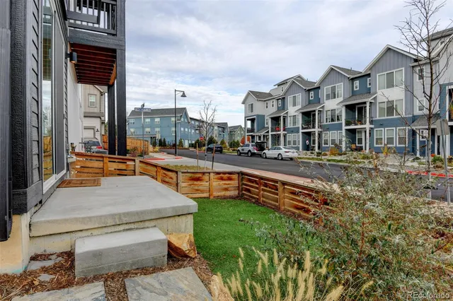 a swimming pool with outdoor seating yard and barbeque oven