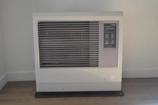 front view of a house with wooden floor and a hallway