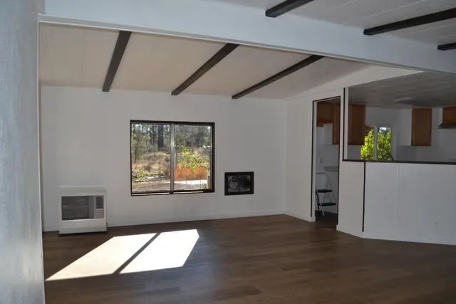 a kitchen with stainless steel appliances a sink stove and cabinets