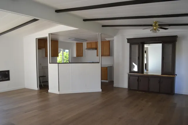 a kitchen with stainless steel appliances granite countertop a sink stove and microwave