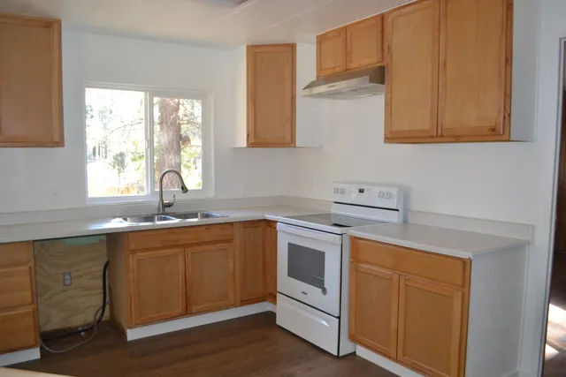 a living room with a fireplace and a rug