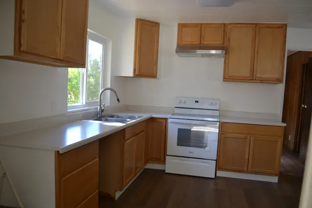 a view of a back yard with a wooden door