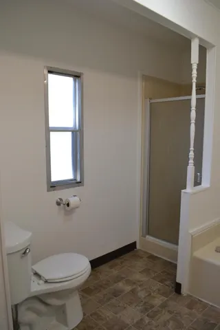 a view of a elevator with wooden floor