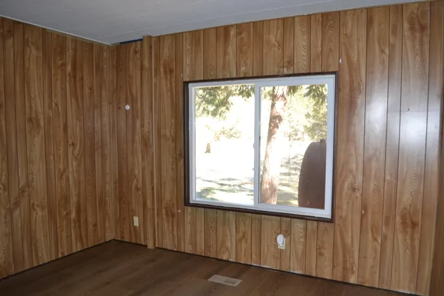 a view of a kitchen with a sink and a window