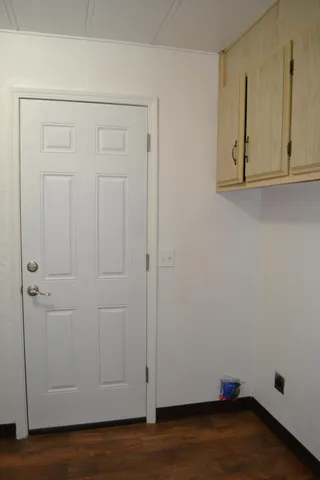 a view of a backyard with large trees