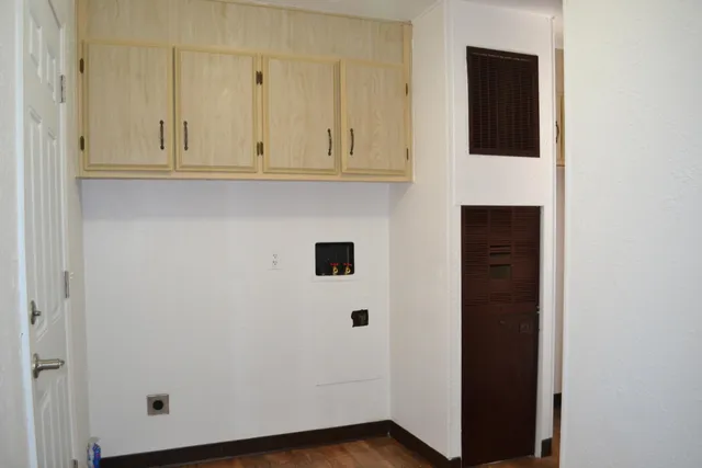 a view of a fire pit with large trees