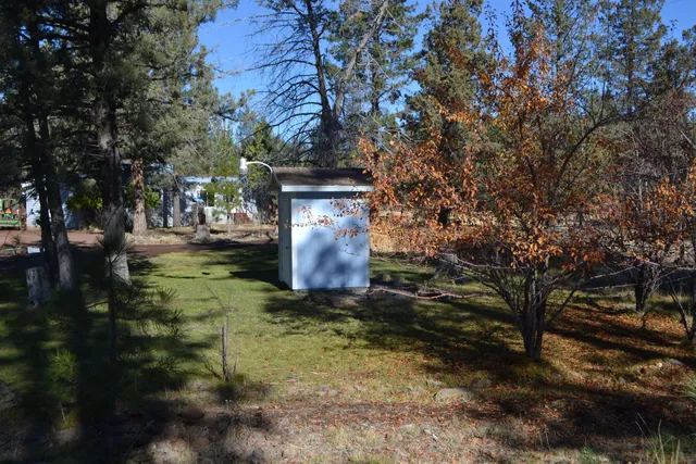 a view of a yard covered with snow